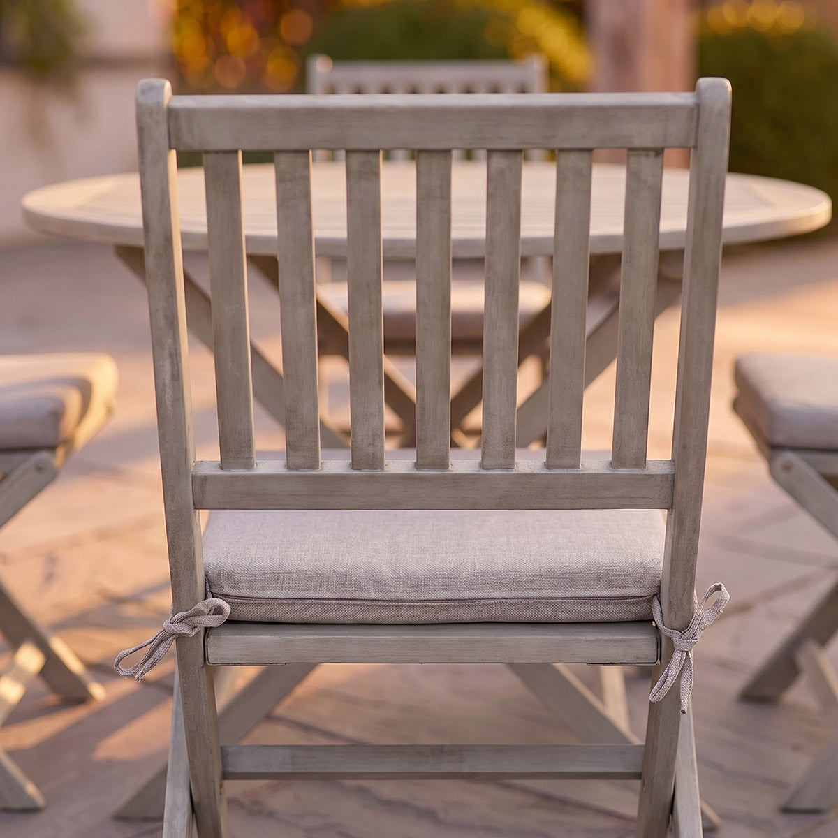 Close-up of the back of the wooden chair from the Vernazza Four Seater Garden Dining Set Digital Illustration 